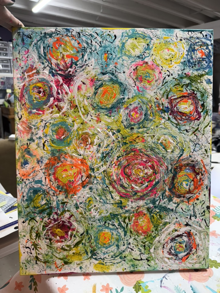 A densely layered abstract painting of stylized roses in many bright colors — pinks, yellows, oranges, teals, blues — drawn over a white-and-grey ground with thin black scribble lines weaving between the blooms.